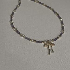 Brimsi Beads 18" Shades of Purple - One of a Kind! Violet beads mixed with gold-filled beads and real freshwater pearls and a rhinestone and gold Bow Pendant