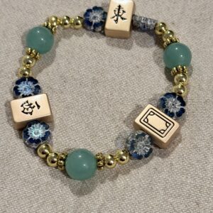 Brimsi Beads Gold MahJongg Charms on a Neutral green mulit-beaded bracelet - stretch size average - large/average
